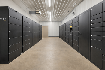 Secure package locker room with modern storage units